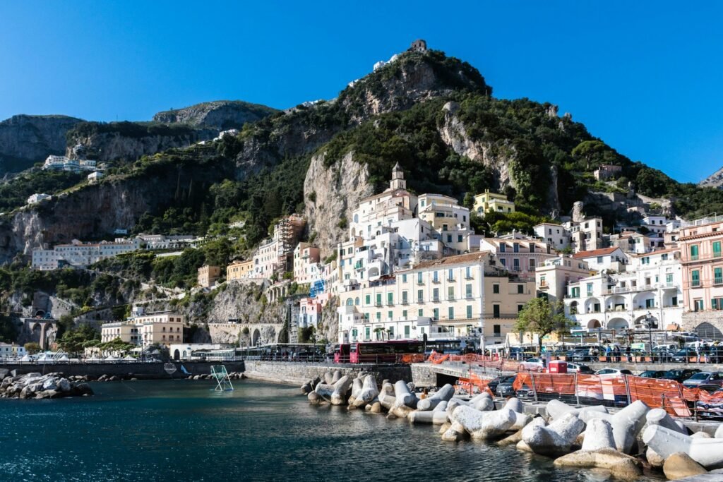 Amalfi waterfront beneath a steep hillside