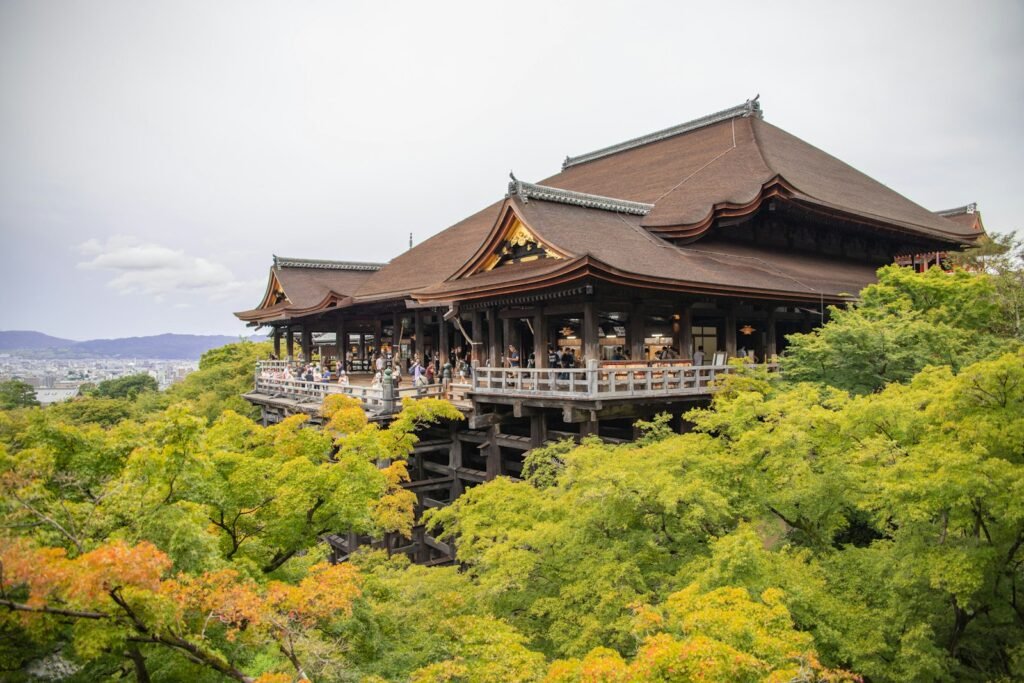 Kiyomizu-dera temple among green trees in Kyoto